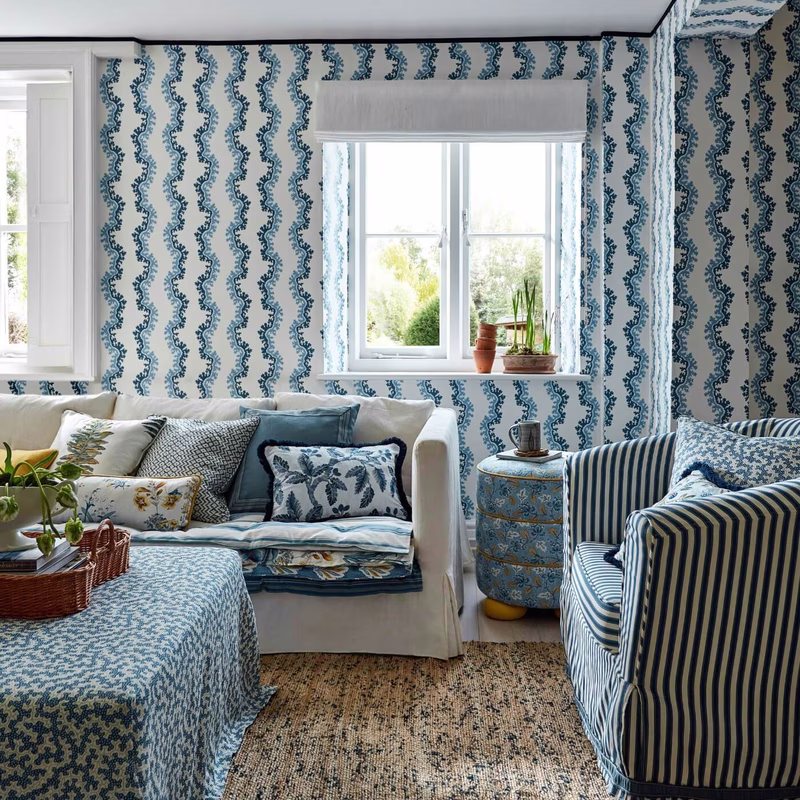 Living room with the patterned fabric used as curtains, a Roman blind, upholstery and cushions.