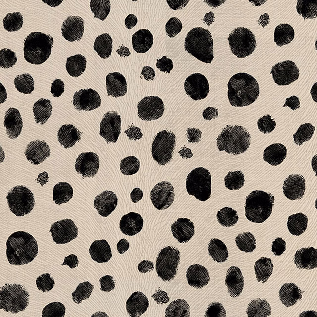 Warm cream woven fabric with irregular black animal-print spots and visible texture