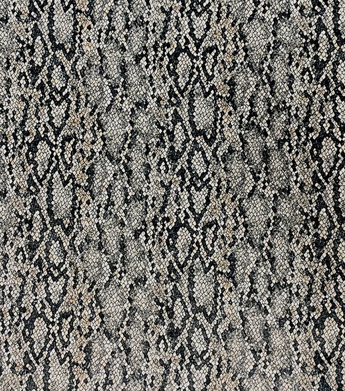 Charcoal, grey and cream snakeskin fabric with a mottled, tactile woven surface