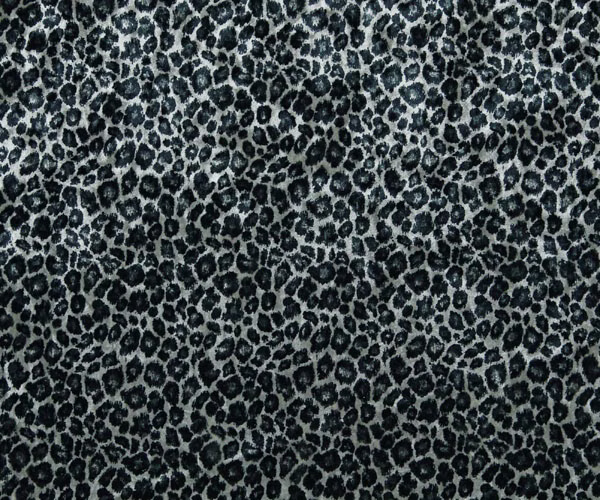 Cool grey textile with dense charcoal leopard rosettes and a softly brushed surface