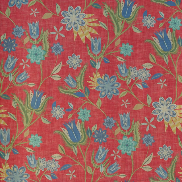 Coral-red botanical fabric with blue tulips, teal flowers and green leafy stems