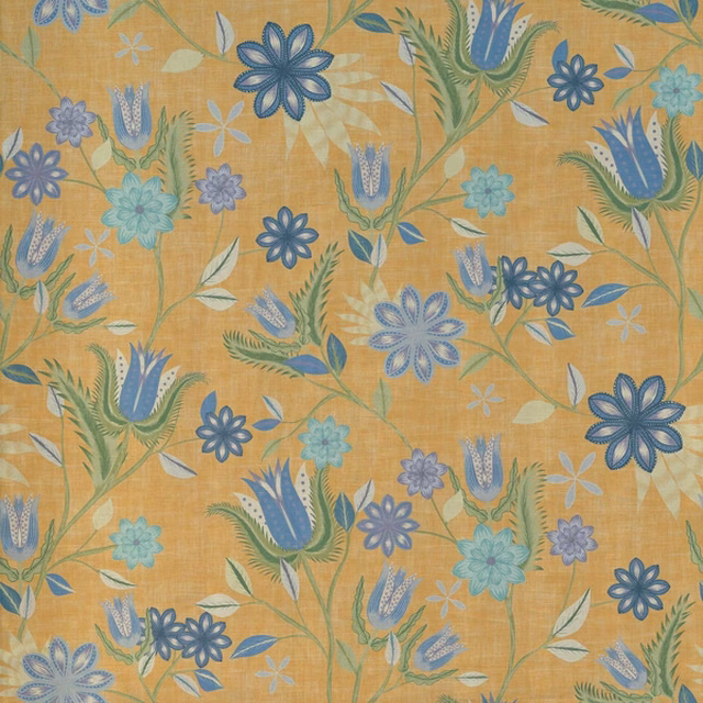 Ochre-gold botanical fabric with blue flowers, teal leaves and textured woven surface
