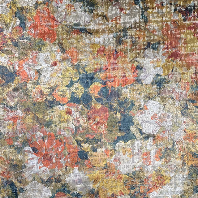 Dense multicoloured floral weave with rust, ochre, dusty blue and cream flecks