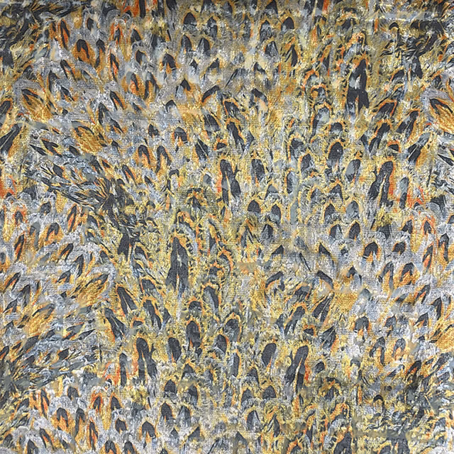 Blue-grey woven ground with charcoal, ochre and rust feather-like marks