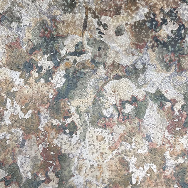 Mottled grey, sage, cream and dusty rose textile with a mineral-like surface