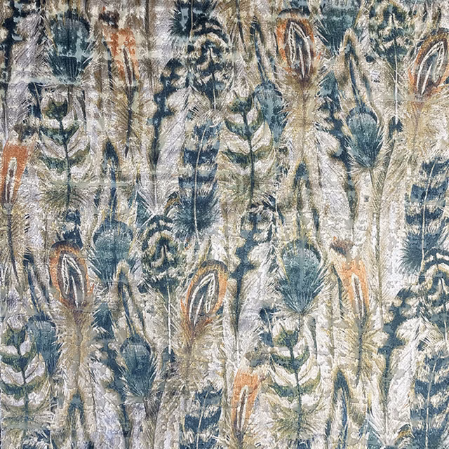 Textured botanical fabric with blue-grey foliage, cream ground, teal leaves and rust accents
