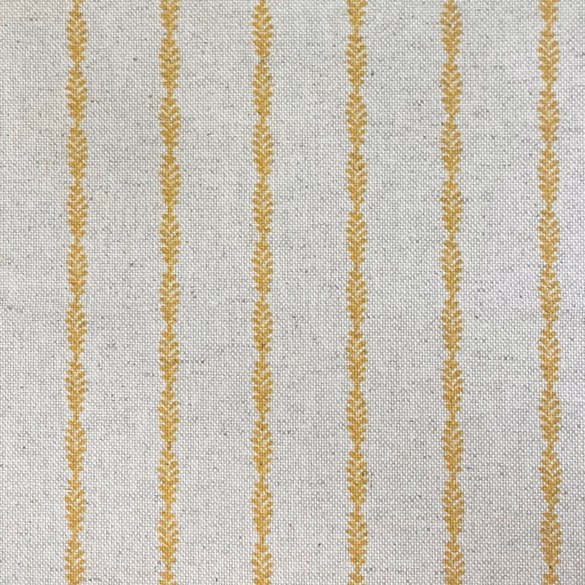 Pale grey woven fabric with muted gold vertical lozenge motifs and fine texture