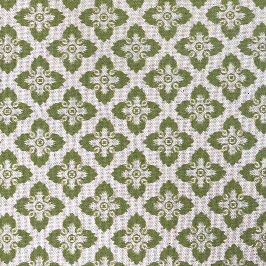 Muted citron-olive ornamental motifs on a textured ivory woven fabric