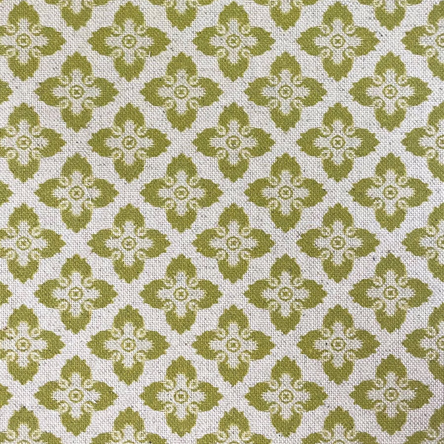 Muted olive-green quatrefoil flowers on a cream woven fabric ground
