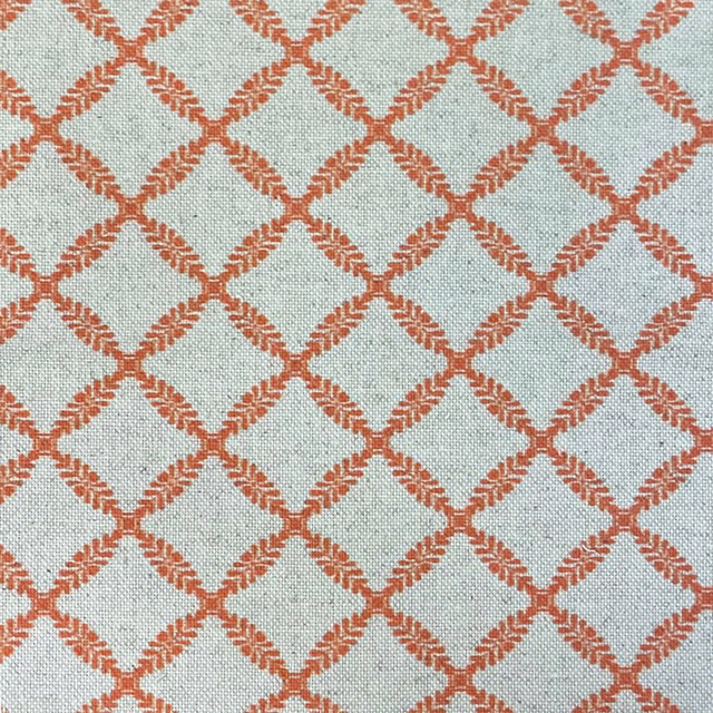 Pale aqua woven fabric with rust-red textured diamond lattice and fine ground texture