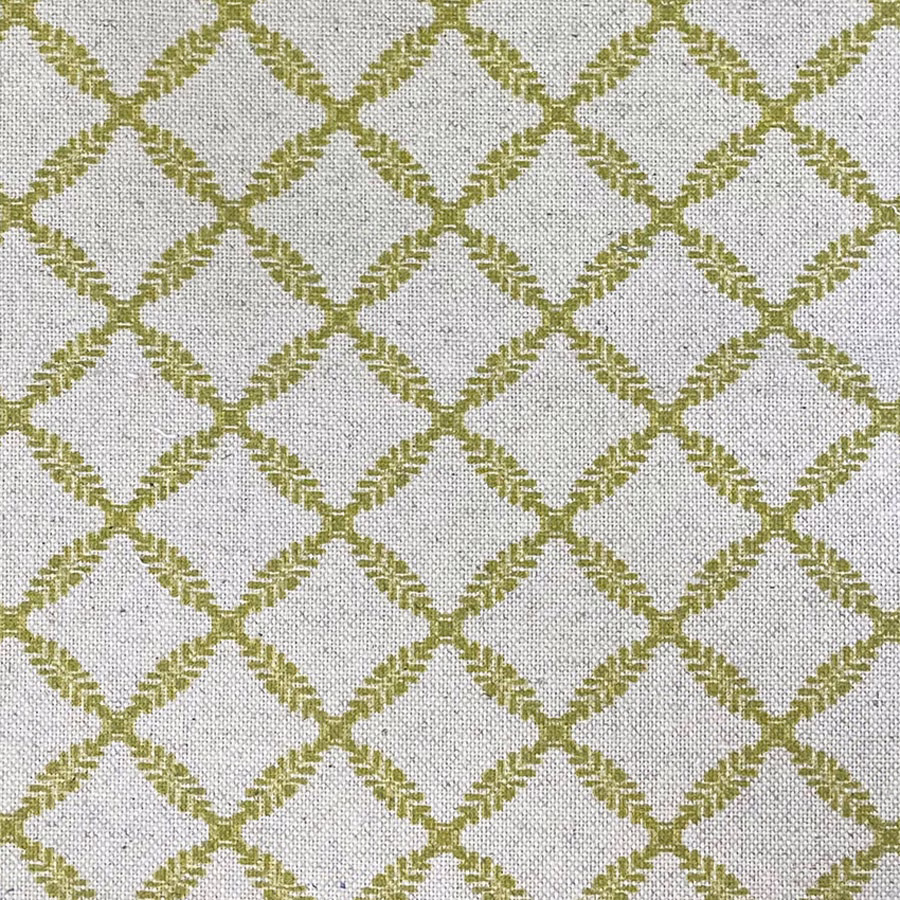 Pale neutral woven fabric with muted kiwi-green diamond trellis and tactile grain