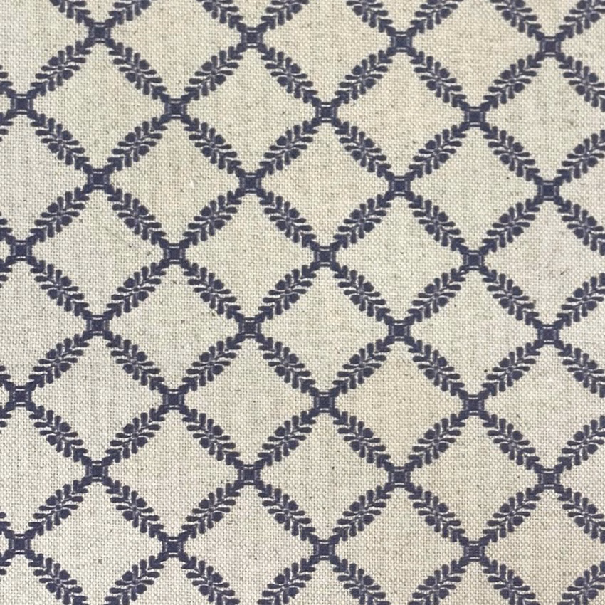 Pale cream woven ground with dark ink-navy leafy diamond trellis pattern