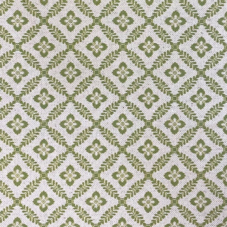 Muted olive-green diamond lattice with cream quatrefoil motifs on a woven ground