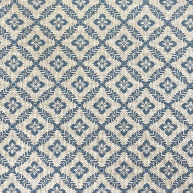 Blue-grey and ivory woven fabric with diamond lattice and quatrefoil motifs