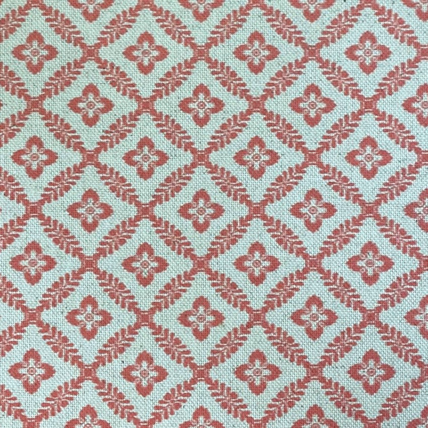 Pale aqua woven ground with coral melon diamond trellis and quatrefoil motifs