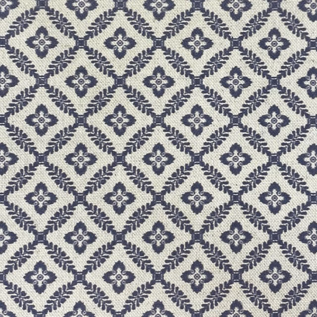 Cream woven ground with navy diamond trellis and small quatrefoil motifs