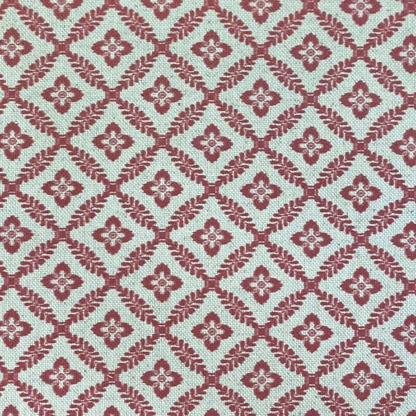 Muted raspberry lattice with cream ground and repeating woven quatrefoil motifs
