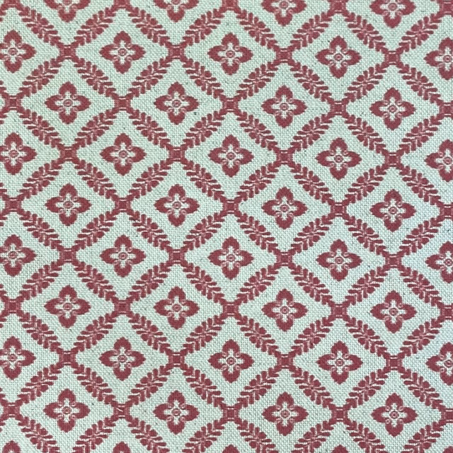 Muted raspberry lattice with cream ground and repeating woven quatrefoil motifs
