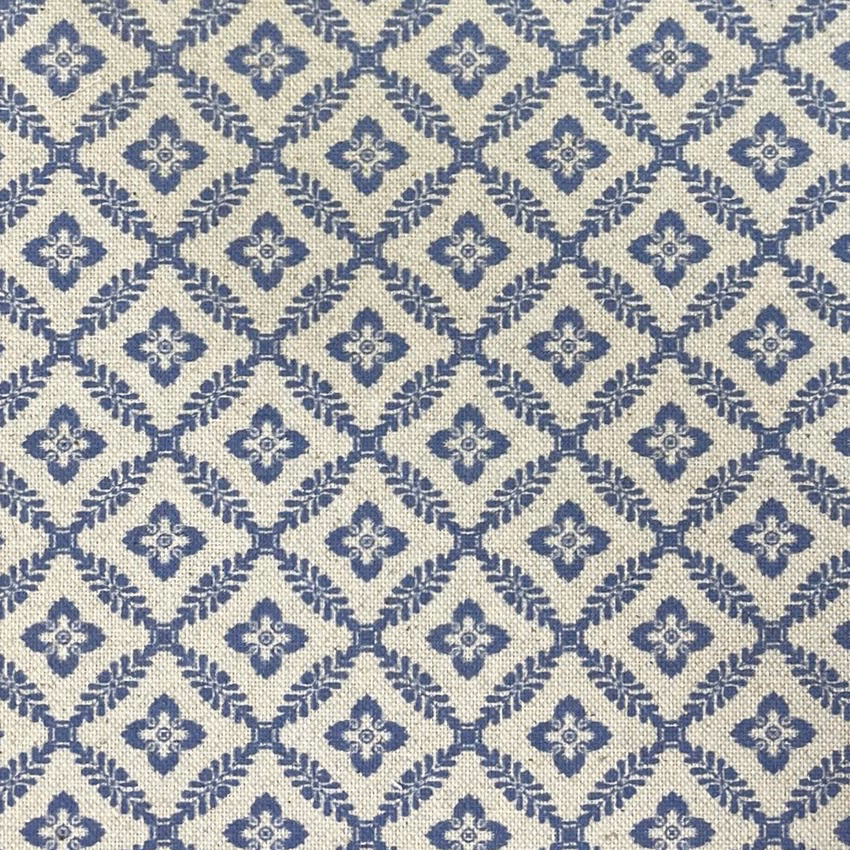 Cream woven textile with muted navy diamond lattice and small floral medallions