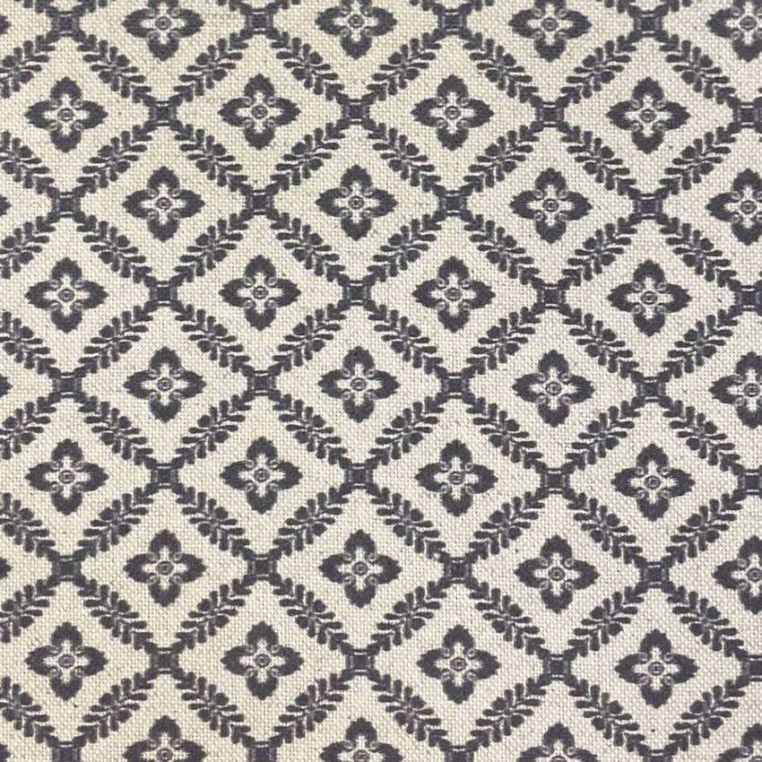 Cream woven fabric with charcoal diamond lattice and small quatrefoil motifs