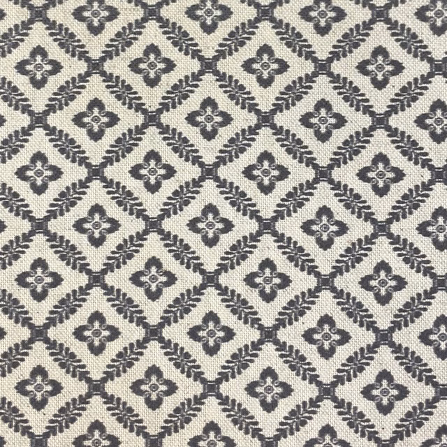 Cream woven fabric with charcoal diamond lattice and small quatrefoil motifs