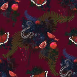 Deep crimson fabric showing coiled snakes, pomegranates, ferns and dark jewel-toned flowers.