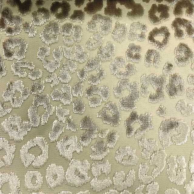 Muted olive woven fabric with pale grey cheetah rosettes and taupe shading