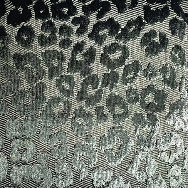 Moss-grey woven cheetah spots with charcoal and silver-grey highlights