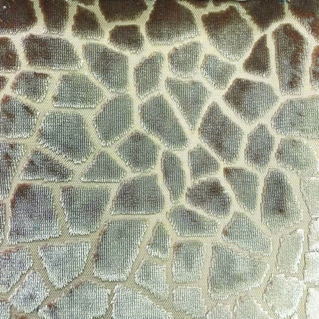 Close-up of sage, taupe and ivory woven mosaic fabric with irregular outlined cells