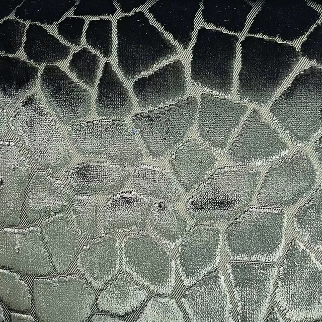 Smoky sage and charcoal woven fabric with large irregular mosaic shapes and textured edges