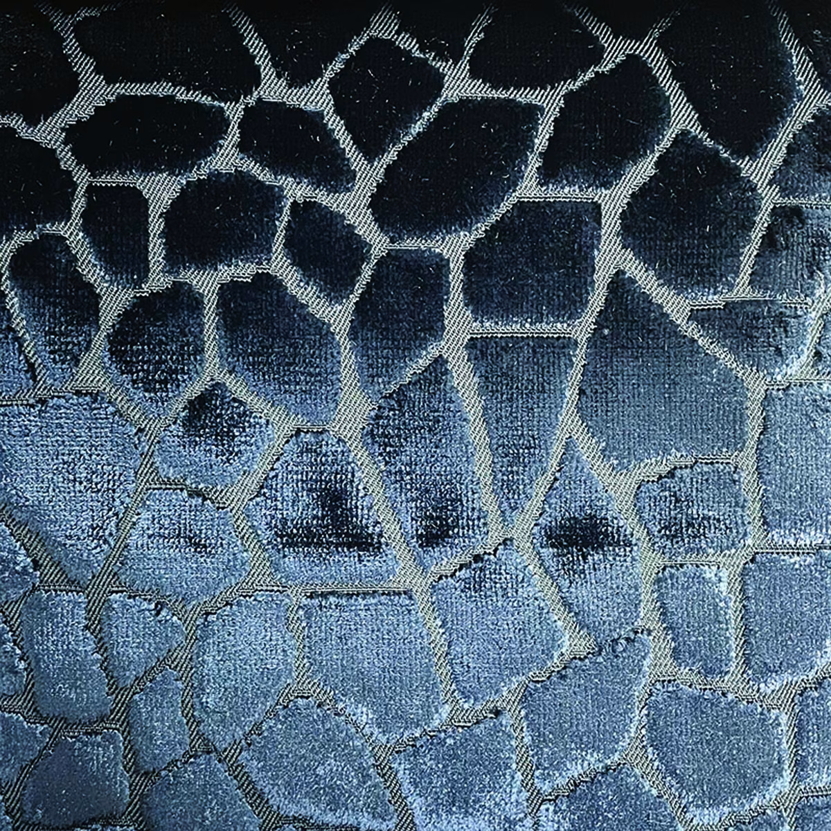 Deep blue-grey woven mosaic with pale silver lines and softly lustrous texture