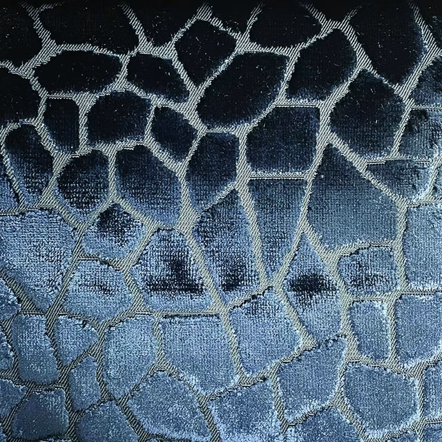 Deep blue-grey woven mosaic with pale silver lines and softly lustrous texture