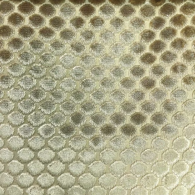 Pale olive woven swatch with mushroom-brown rounded spots and subtle surface sheen