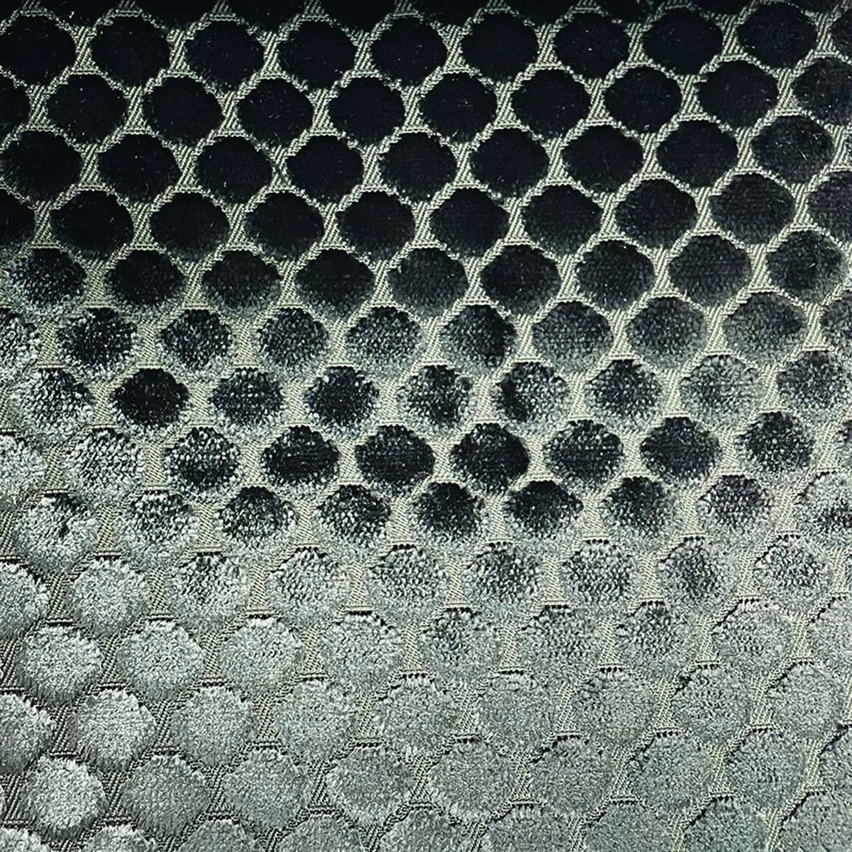 Charcoal to silver grey woven spot lattice with softly textured rounded motifs