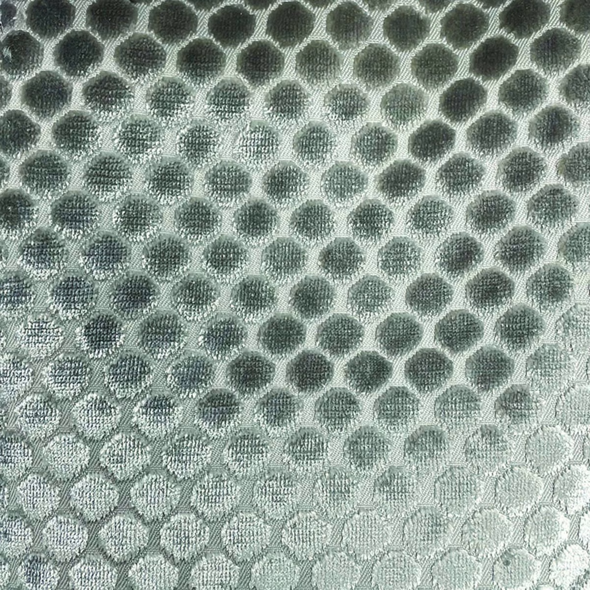 Silvery sage woven fabric with charcoal pebble spots and a tactile honeycomb repeat