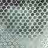 Silvery sage woven fabric with charcoal pebble spots and a tactile honeycomb repeat