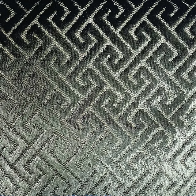 Charcoal and sage-grey woven fabric with raised interlocking trellis texture