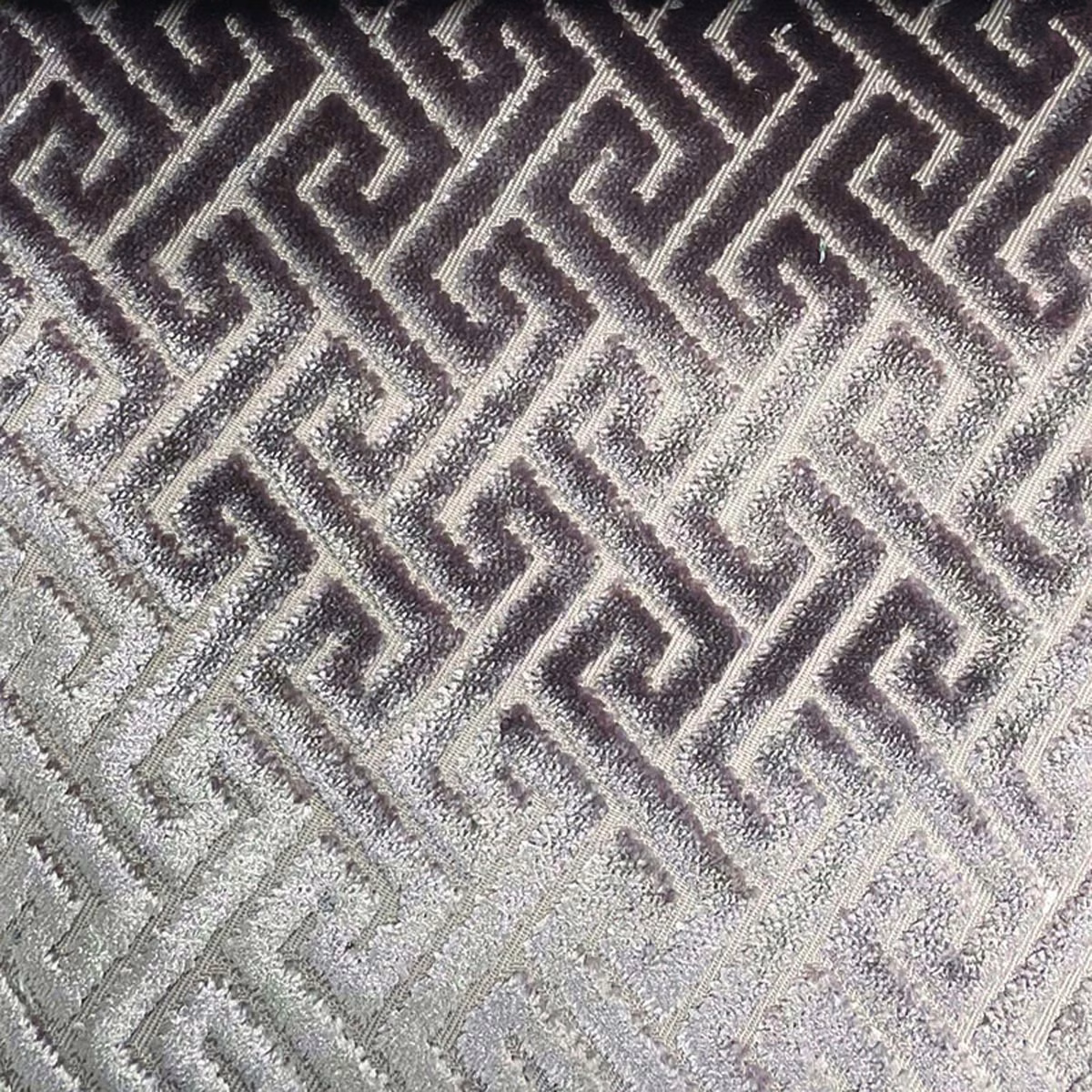 Charcoal and silver-grey woven fabric with textured geometric Greek-key trellis pattern