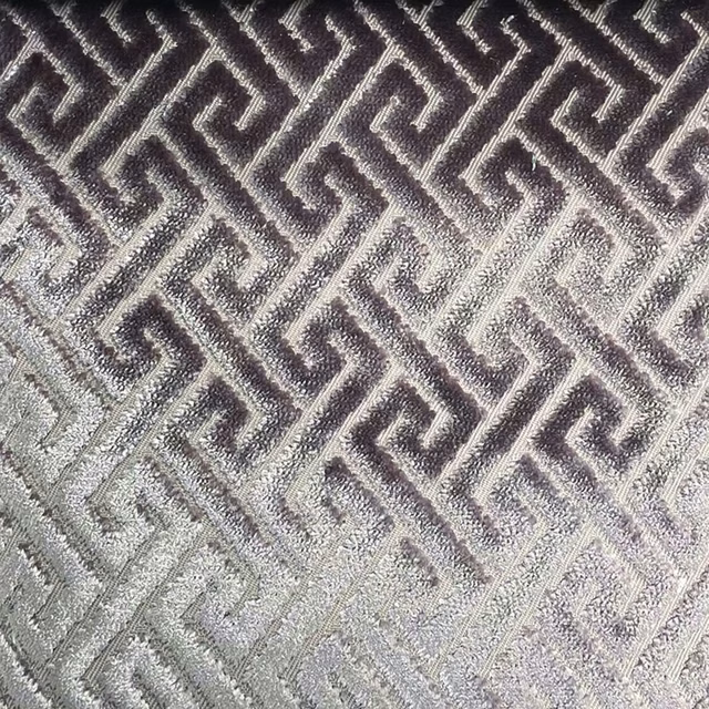 Charcoal and silver-grey woven fabric with textured geometric Greek-key trellis pattern