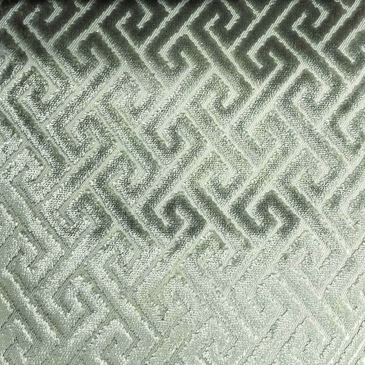 Pale sage-grey woven fabric with raised angular trellis pattern and tactile texture