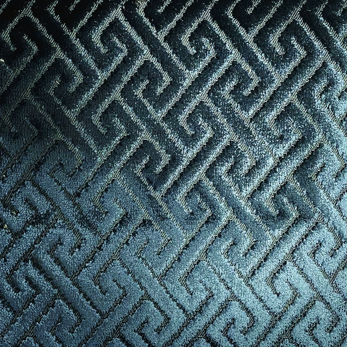 Deep blue-teal raised trellis fabric with shifting light-catching woven texture