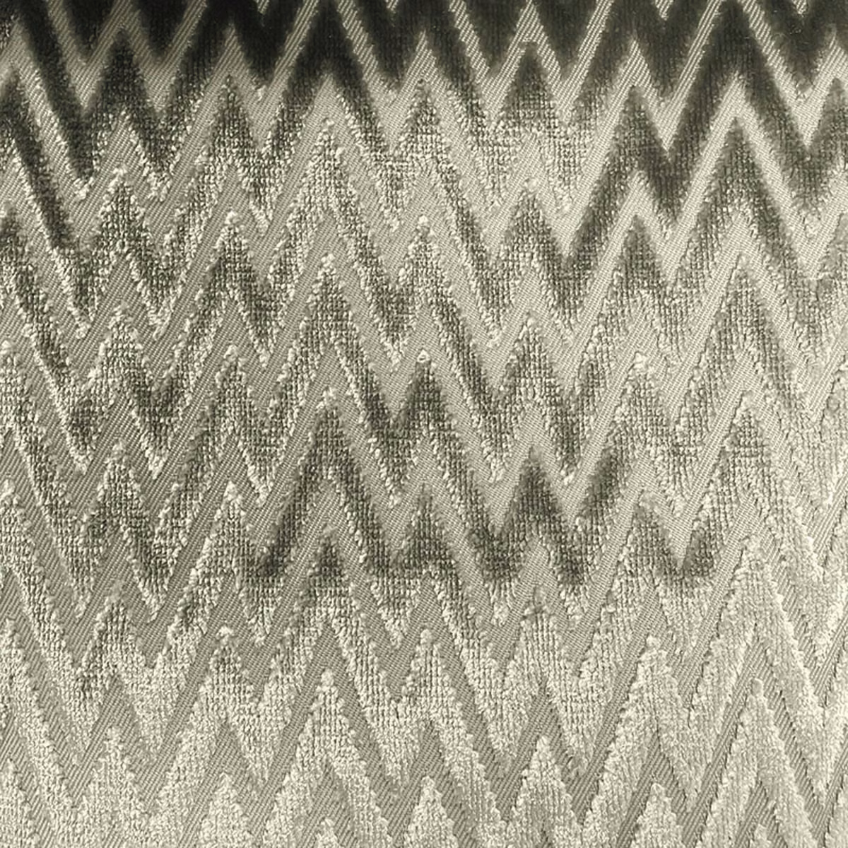 Stone grey and charcoal woven fabric with repeating textured zigzag chevrons