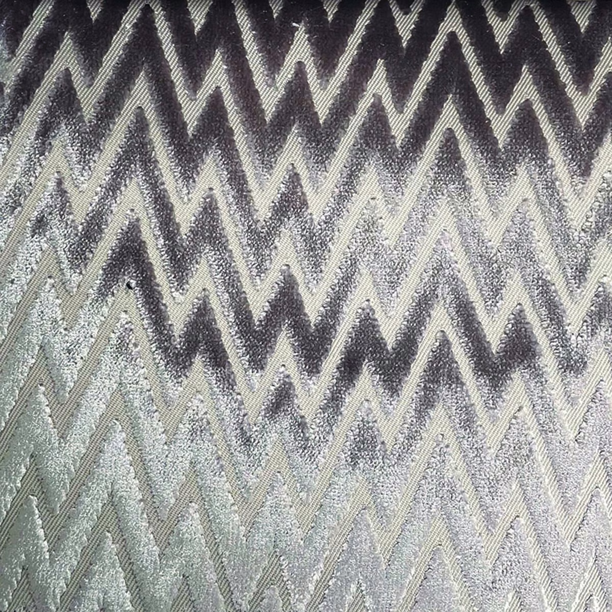 Charcoal and silver-grey woven zigzag textile with raised, tactile chevron texture