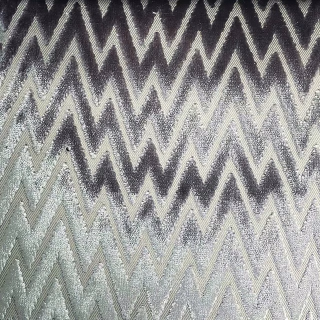 Charcoal and silver-grey woven zigzag textile with raised, tactile chevron texture