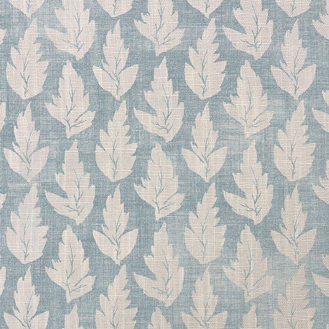 Blue-grey woven fabric with repeated ivory leaves and softly slubbed texture