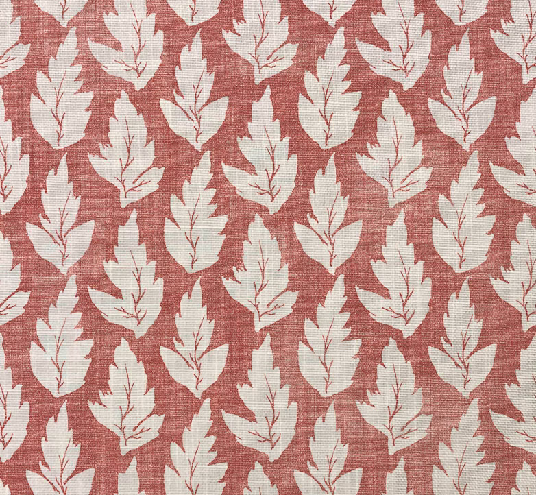 Muted terracotta woven fabric with repeating cream serrated leaf motifs and visible texture