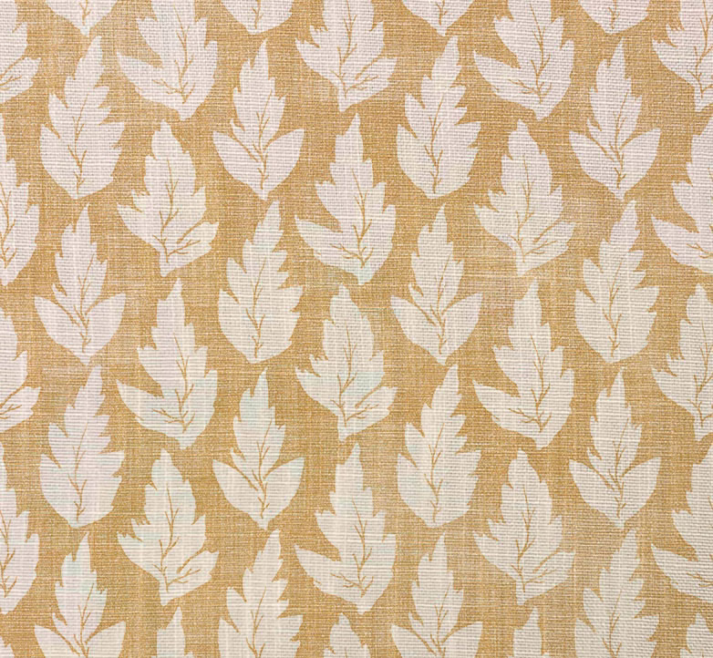 Ochre woven fabric with repeating ivory leaf motifs and subtle crosshatched texture