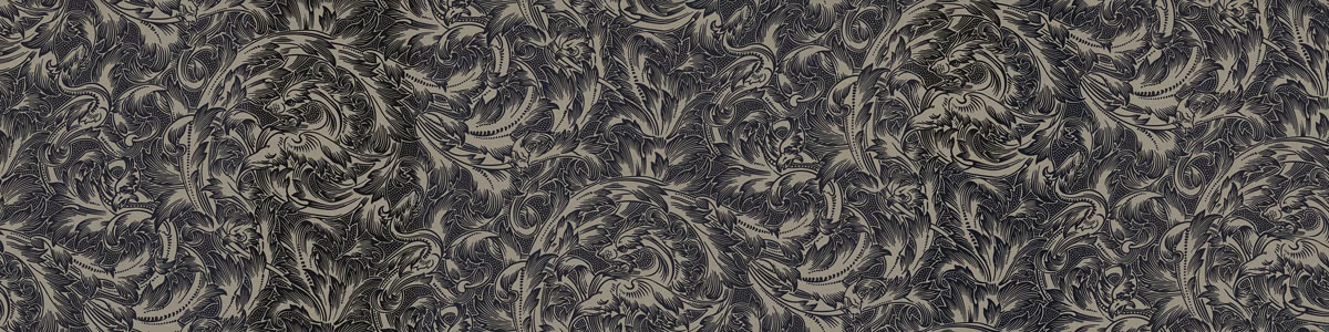 Charcoal-olive textile with dense curling botanical motifs and softly flecked highlights