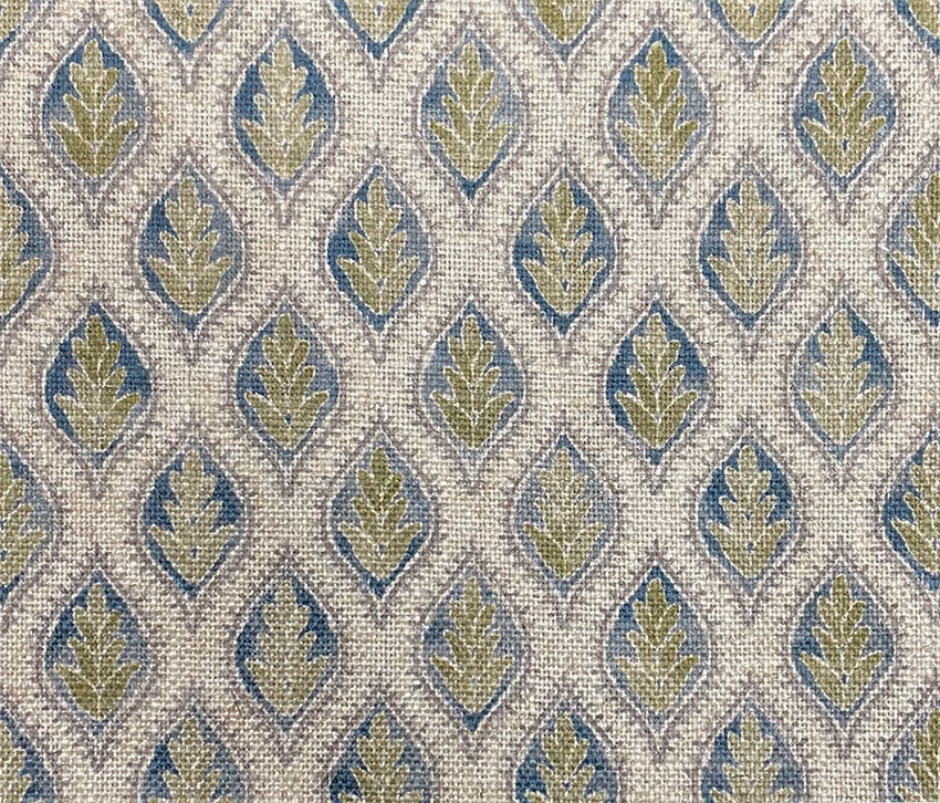 Ivory woven fabric with repeating muted blue and olive leaf medallions