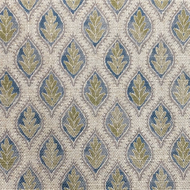 Ivory woven fabric with repeating muted blue and olive leaf medallions